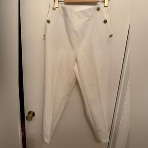 Pleated white dress pants with gold buttons